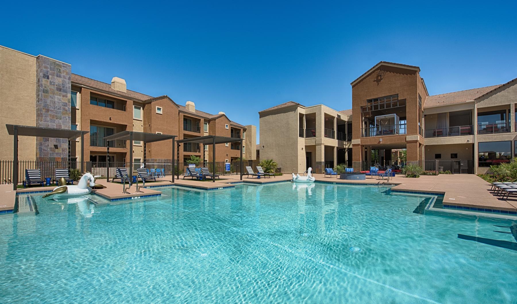 a swimming pool in front of a building