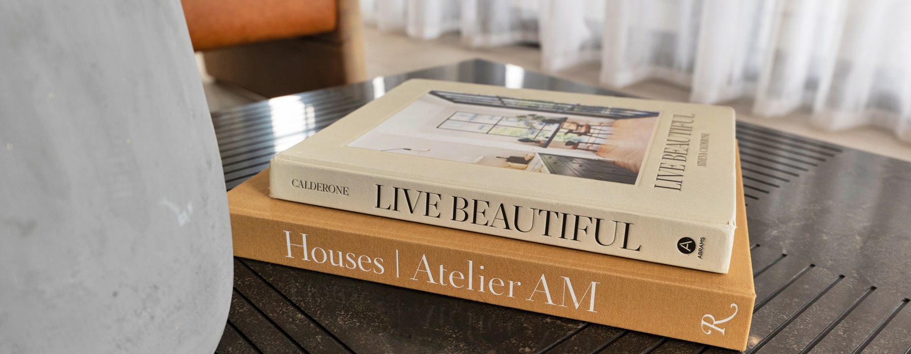 art books in model unit on table | The Cooper 202