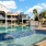 a swimming pool in front of a large building