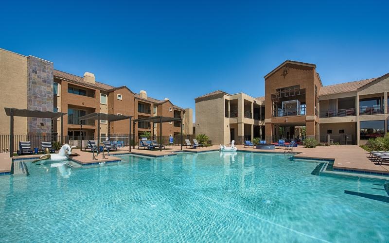 a swimming pool in front of a building