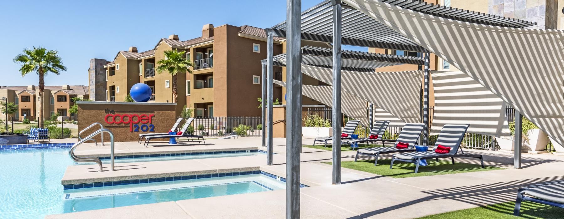 a swimming pool with a building in the background